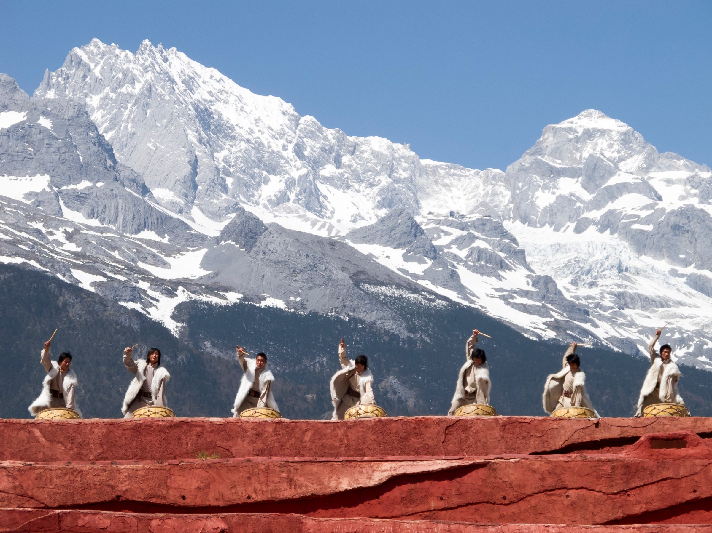 Naxi drummers performing beneath Jade Dragon Snow Mountain